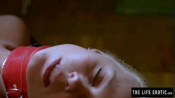 Cute blonde gets tied up in chains while she masturbates